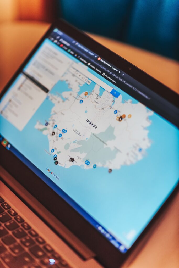A laptop showing a webpage with a map and markers, indicating different local businesses. The text on the screen reads: 5 Proven Strategies to Boost Local SEO and Increase Online Visibility for Small Businesses.